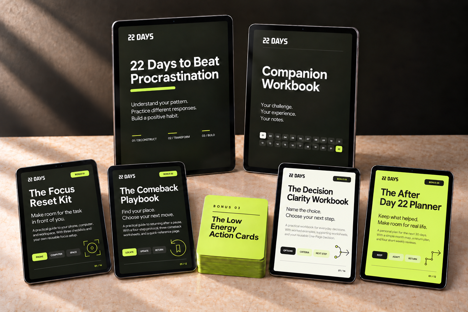The complete 22 DAYS digital pack shown on six tablets: the challenge, Companion Workbook and four bonus PDFs, alongside the Low Energy Action Cards.